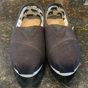 Black Toms Slip-ons